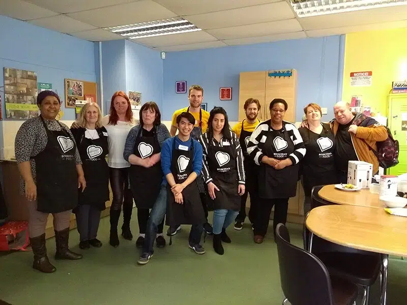 a group picture of a corporate cooking day