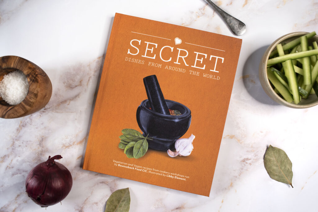 A image of our first Bounceback Food Cookbook called Secret Dishes From Around The World