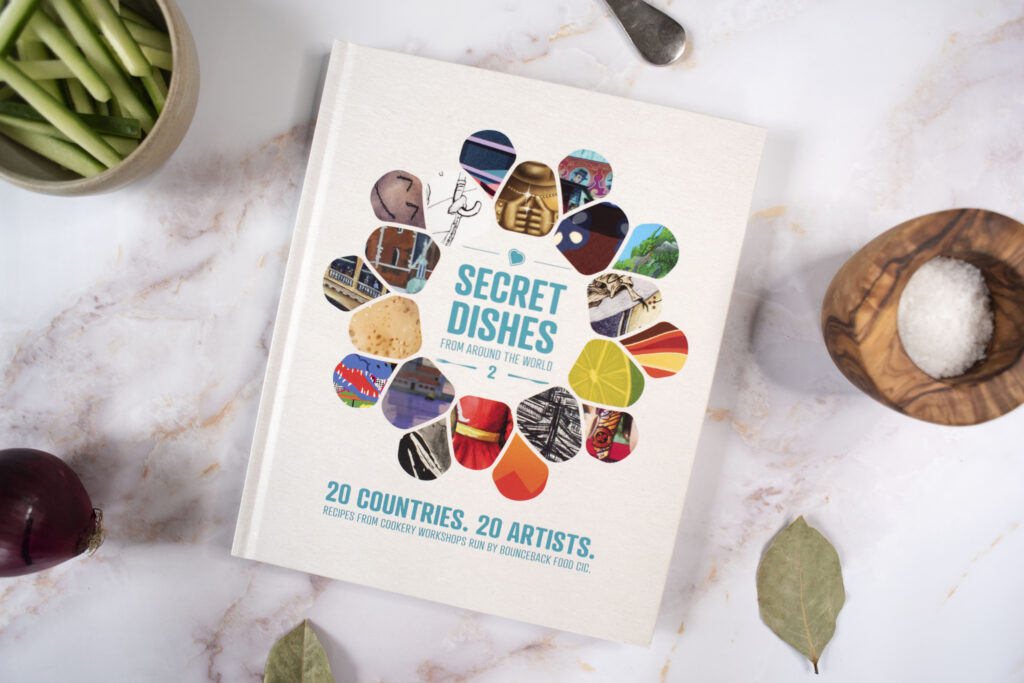 A image of our second Bounceback Food Cookbook called Secret Dishes From Around The World 2